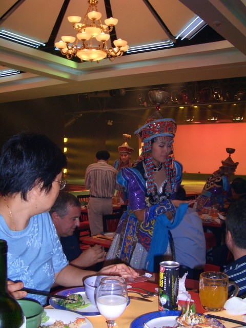 My mother enjoying the entertainment (and food!)