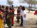 The 'Women' Welcome Dance (you can see the tour micro-buses in the background).
