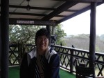 Weaver birds in the background.