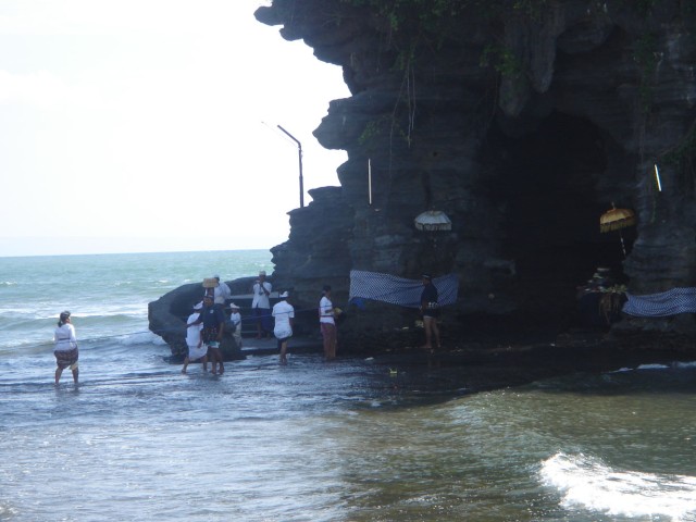 During low-tide (as pictured), this allows the Pilgrims to walk across the shallow water towards the Temple.