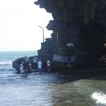During low-tide (as pictured), this allows the Pilgrims to walk across the shallow water towards the Temple.