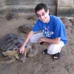 Aaron rubbing the turtle's head