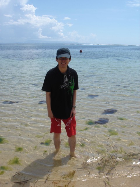 Chislon deeping his toes in the water (which were full of Jellyfish!)