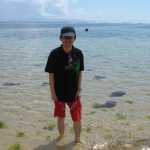 Chislon deeping his toes in the water (which were full of Jellyfish!)