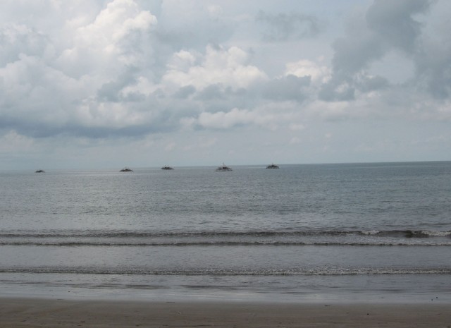 Fishing boats on the horizon
