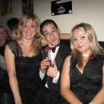 A handsome gentlemen with two of the ladies of the night.