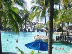 A view of the swimming pool and beach below