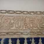 I think this read "Allāh, al Waţan, al Malik" ("for God, for Country, for King").