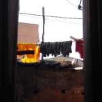 The freshly dyed materials let out to dry in the sunlight.  The dyes were all natural, e.g. saffron from the yellow.