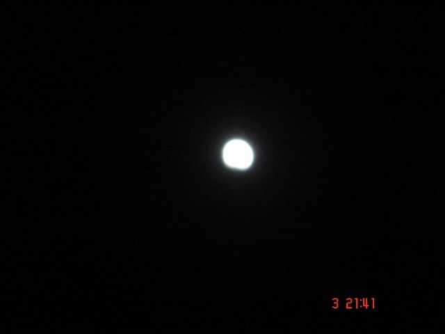 The southern edge of the moon is slowly eroded by the Earth's shadow.