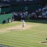 Berdych returning a Federer shot.